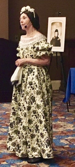 woman in period clothing teaching the residents about Abraham Lincoln