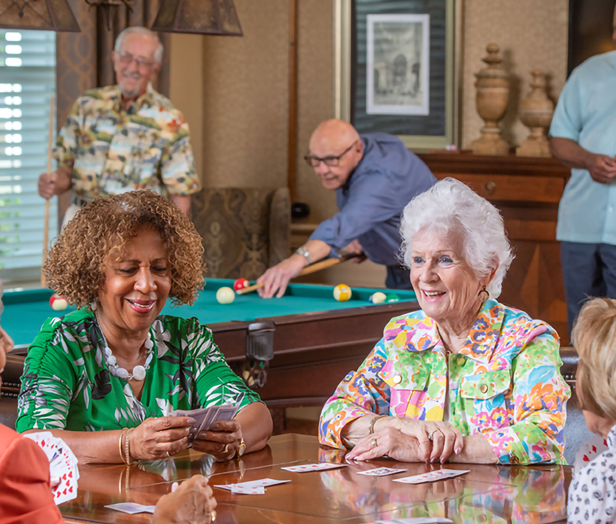 A group of senior women playing cards