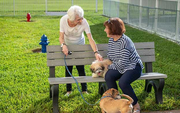 senior women at dog park