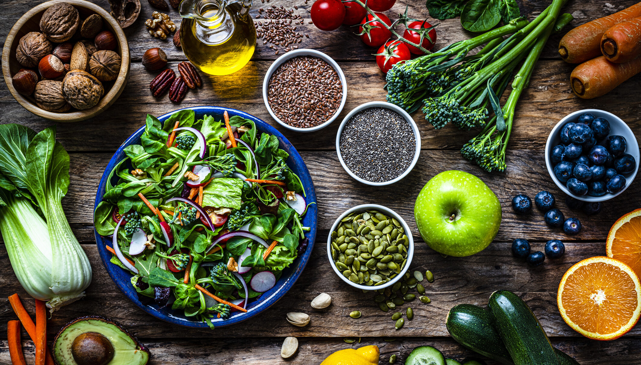 Healthy fruits and vegetables salad plate on rustic table