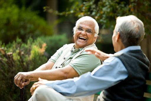 seniors smiling outside in nature